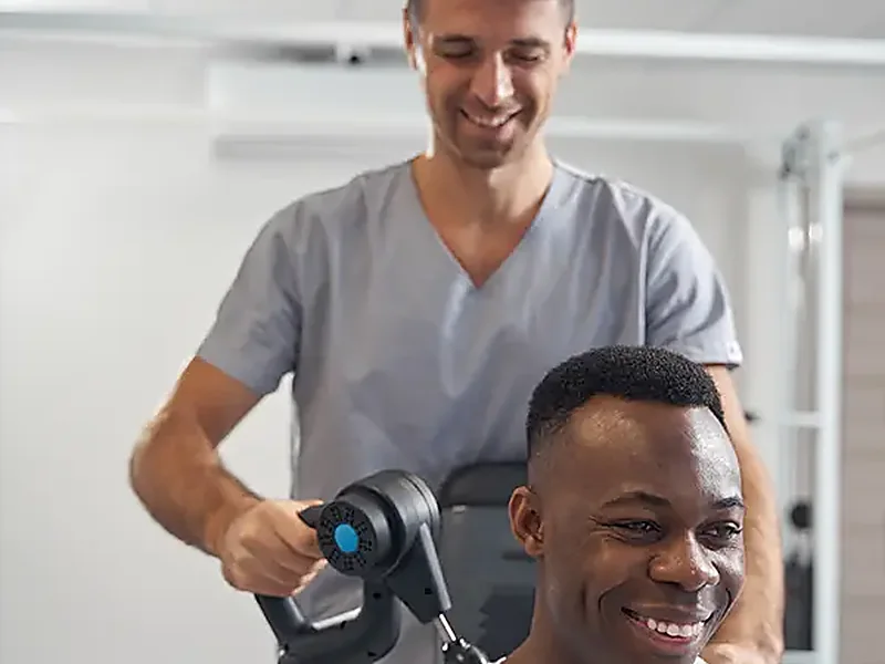 A therapist working hands-on with a patient