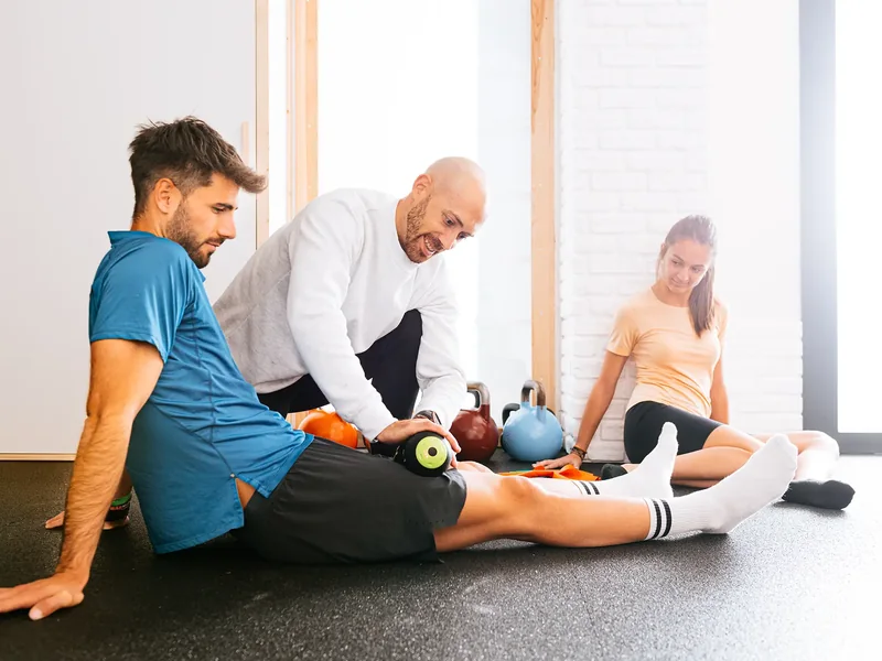 A physical therapist treating an athlete