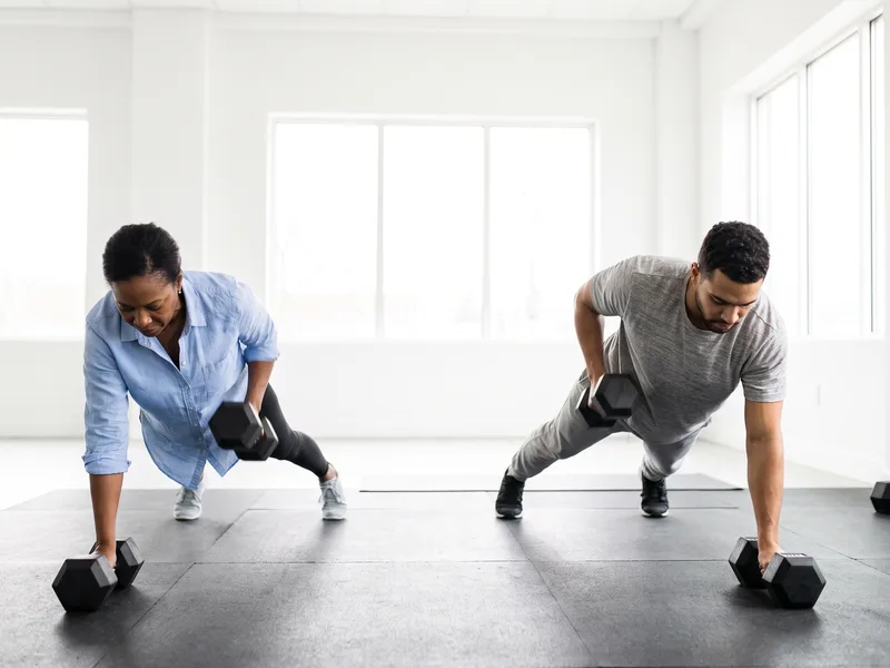 Patients performing progressive dumbbell strength training