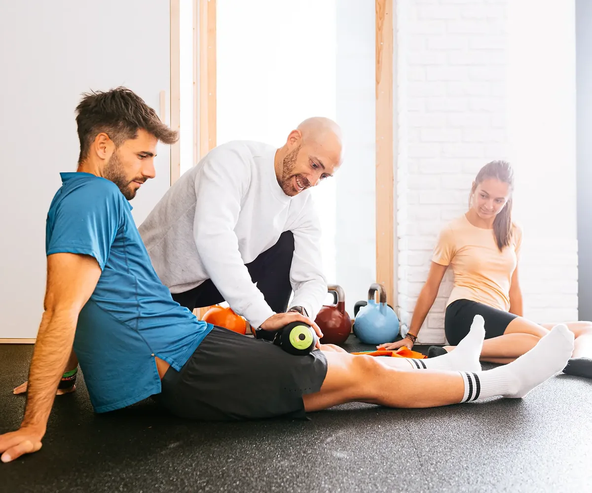 Physical therapist guiding a patient through a hands-on physical therapy session