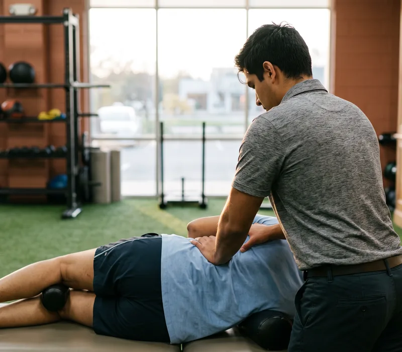 A therapist treating a patient